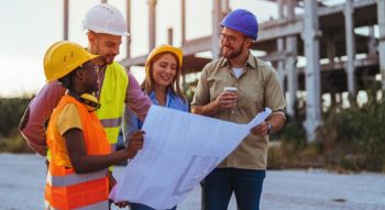 a construction team meeting on a worksite